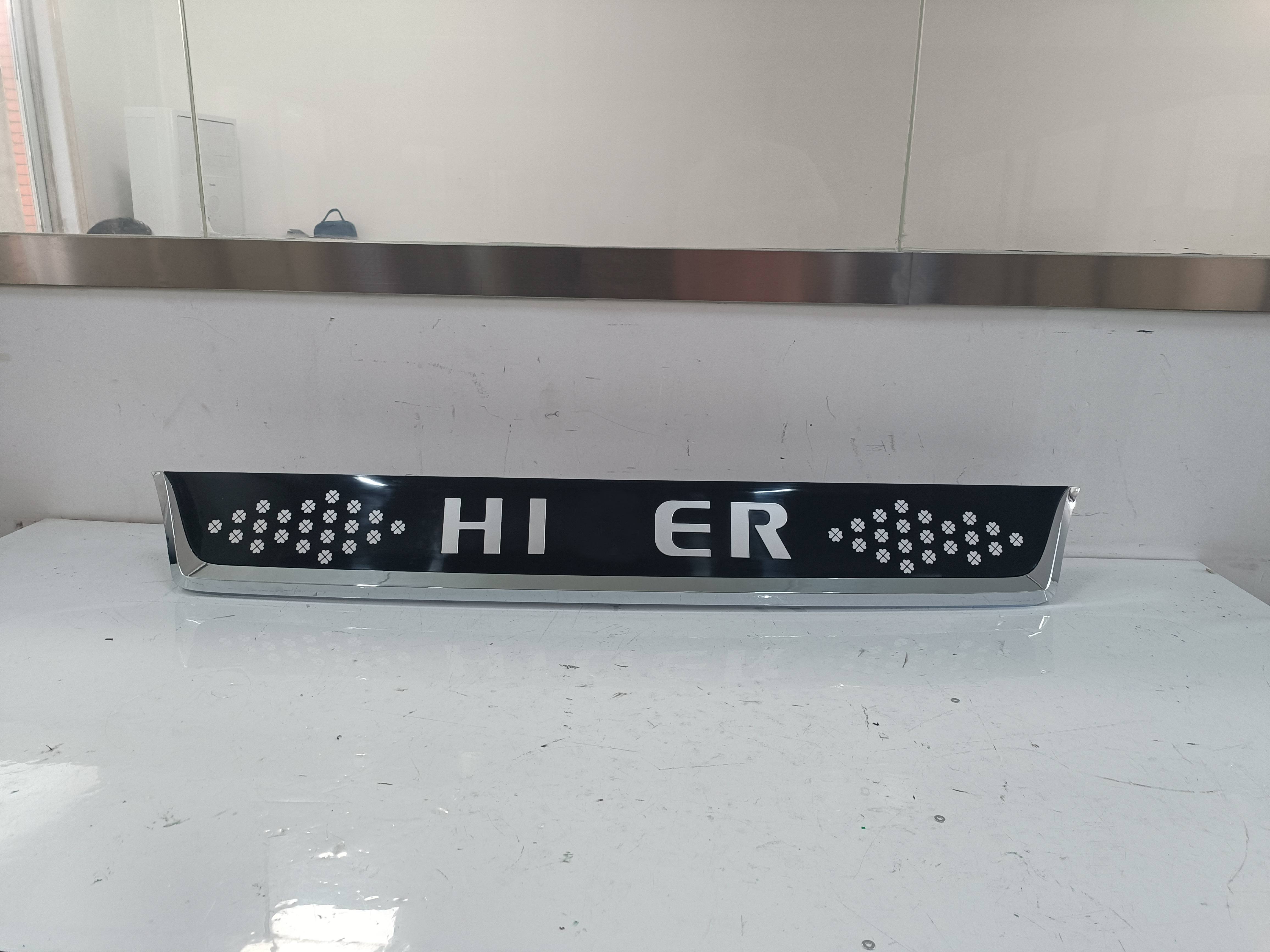 HC-B-24144 Anti-Fade Front Grille Emblem Trim for Bus OE 53LVV-07200-A03, Dimension 1396.16*58.27mm